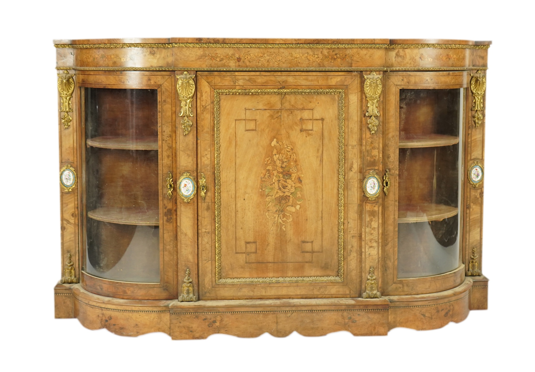 A Victorian marquetry inlaid, gilt metal mounted bowfront side cabinet